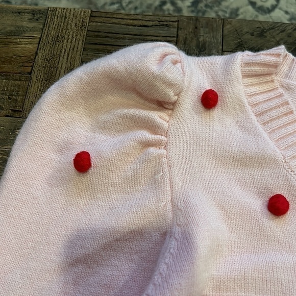 Pink V Neck Sweater With Puff Sleeves and Red Pom Poms - Picture 9 of 11